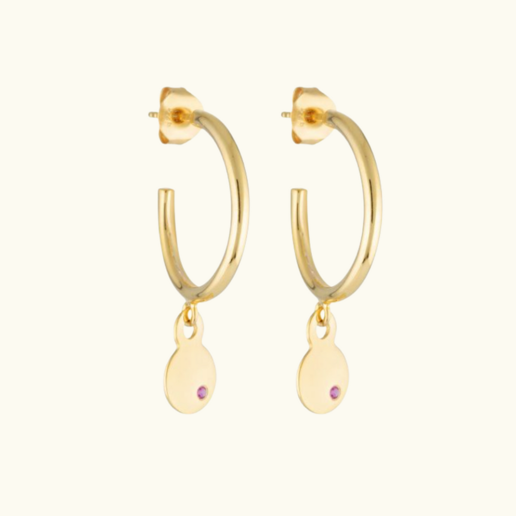 gold hoop earrings with a drop charm